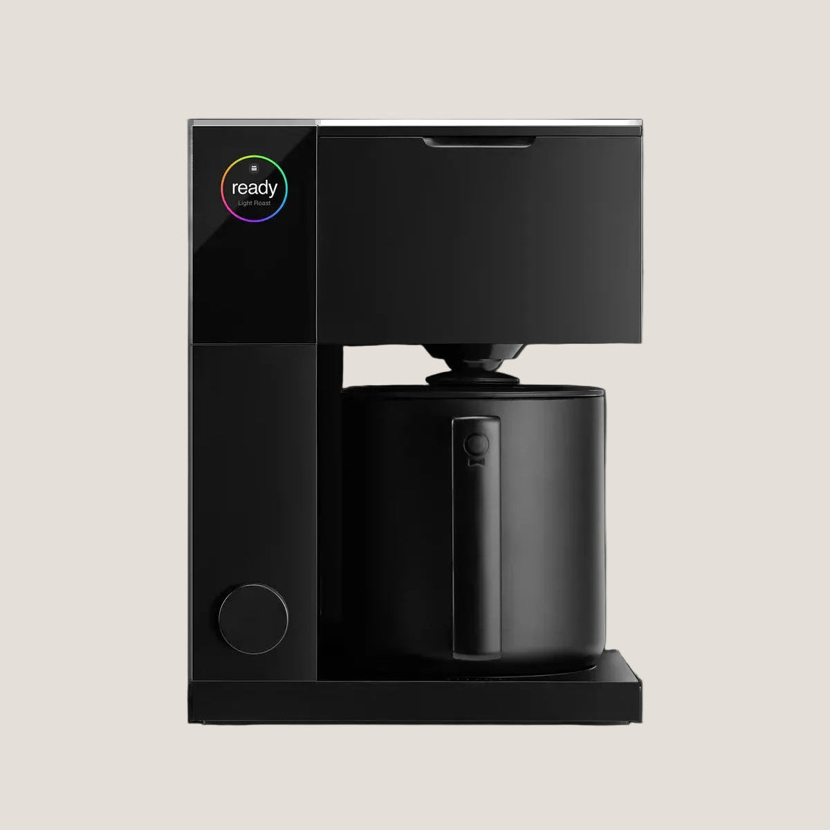 Black coffee machine with a 'ready' indicator on a white background