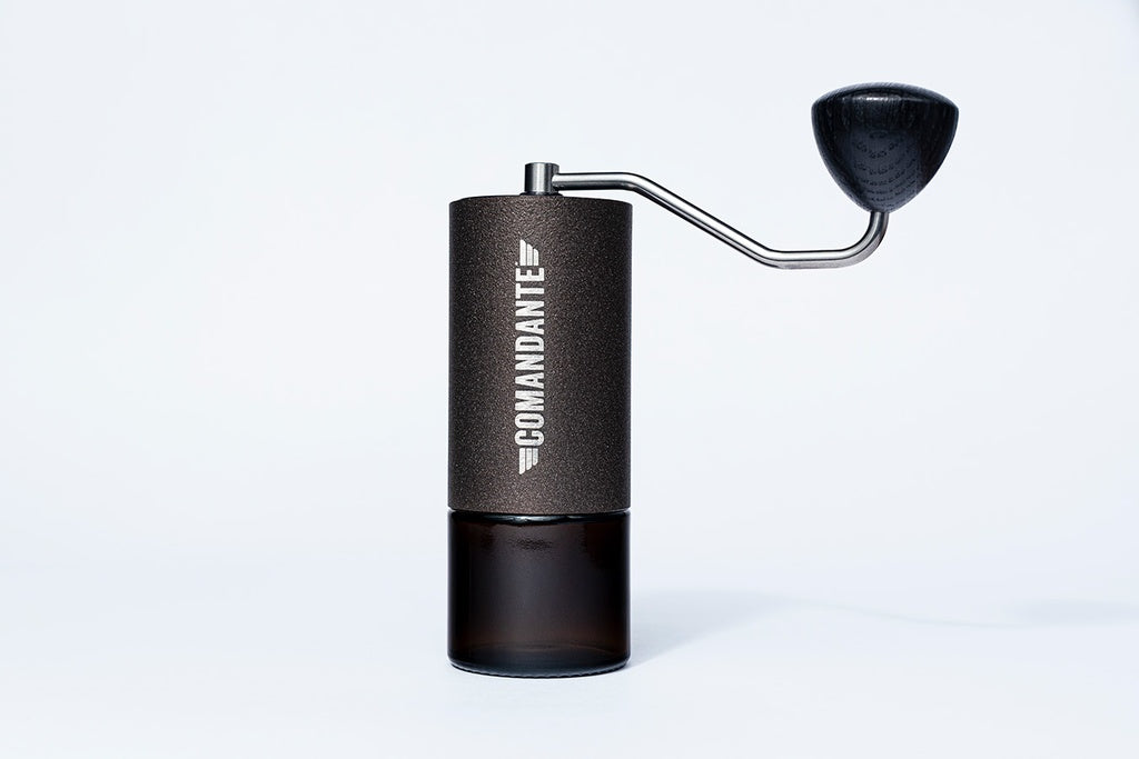 Comandante C40 MK4 Nitro Blade hand coffee grinder with copper accents, designed for precise grinding by Cloud Picker Coffee.
