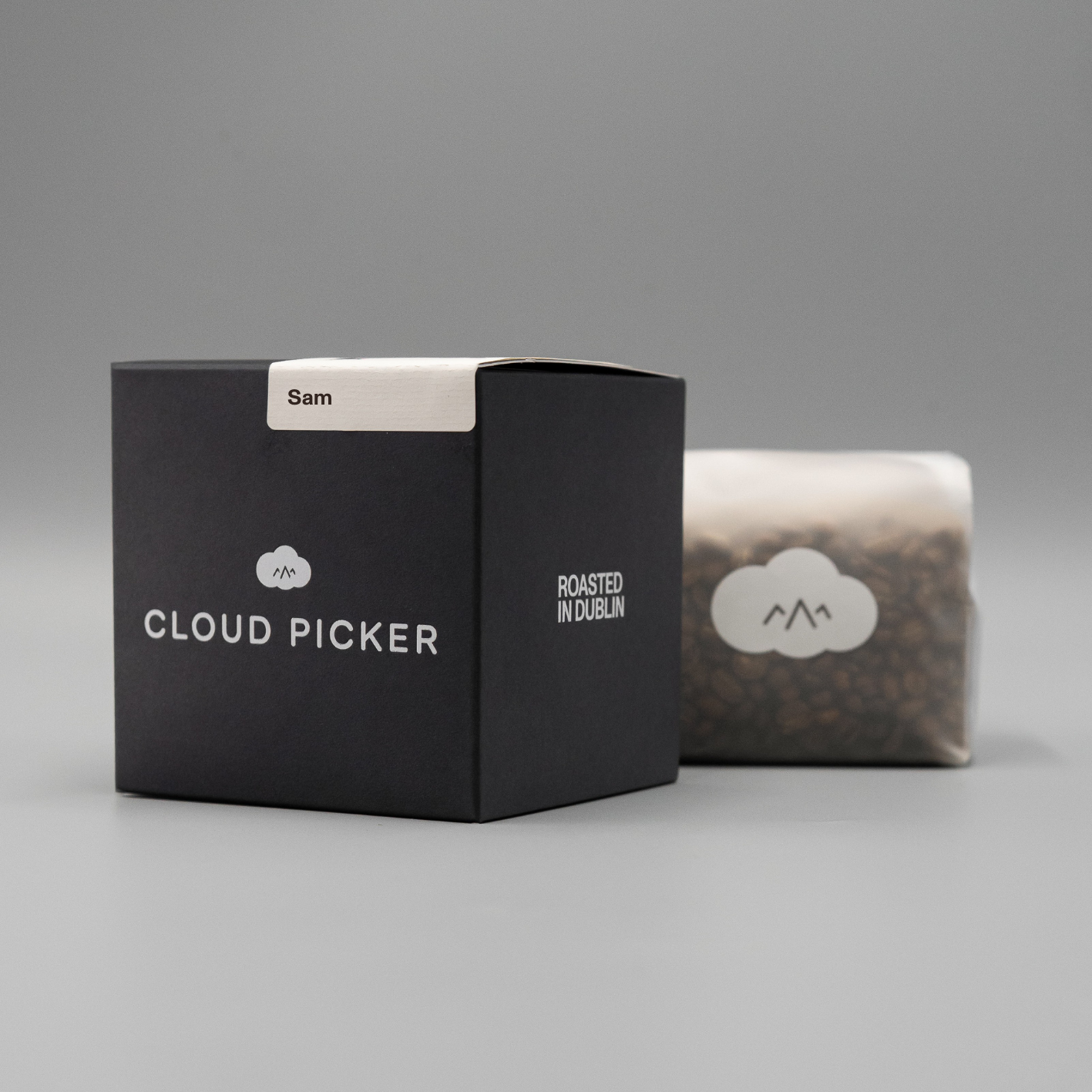A bag of Cloud Picker Coffee's Sam coffee blend with a label featuring the brand name and blend details.