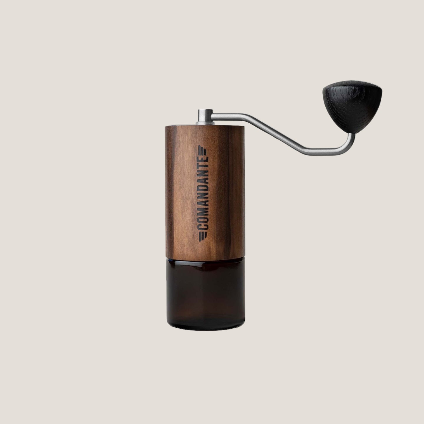 Comandante C40 Nitro Blade hand coffee grinder with Liquid Amber finish, showcasing its durable build and premium grinding mechanism.