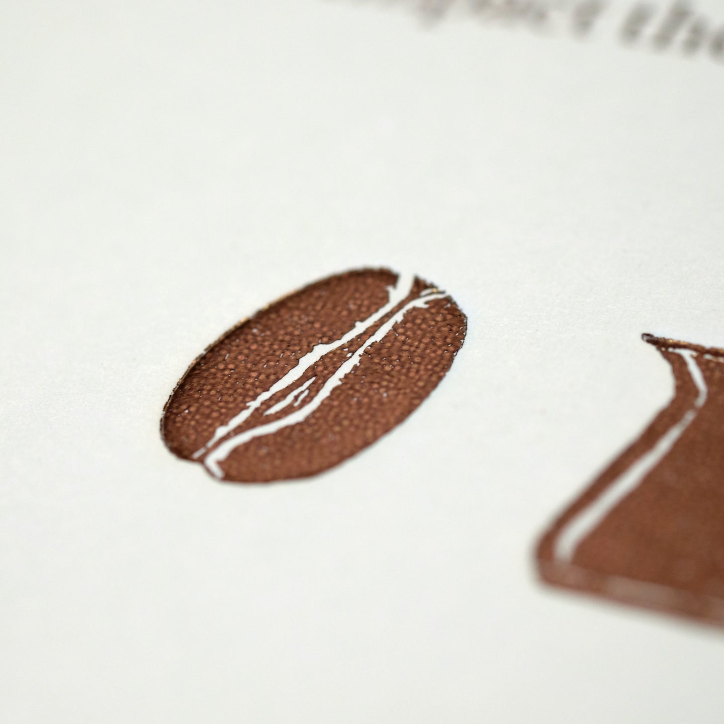 Close-up of "The Coffee Dictionary" accessory by Cloud Picker Coffee, showing detailed cover and textured surface.