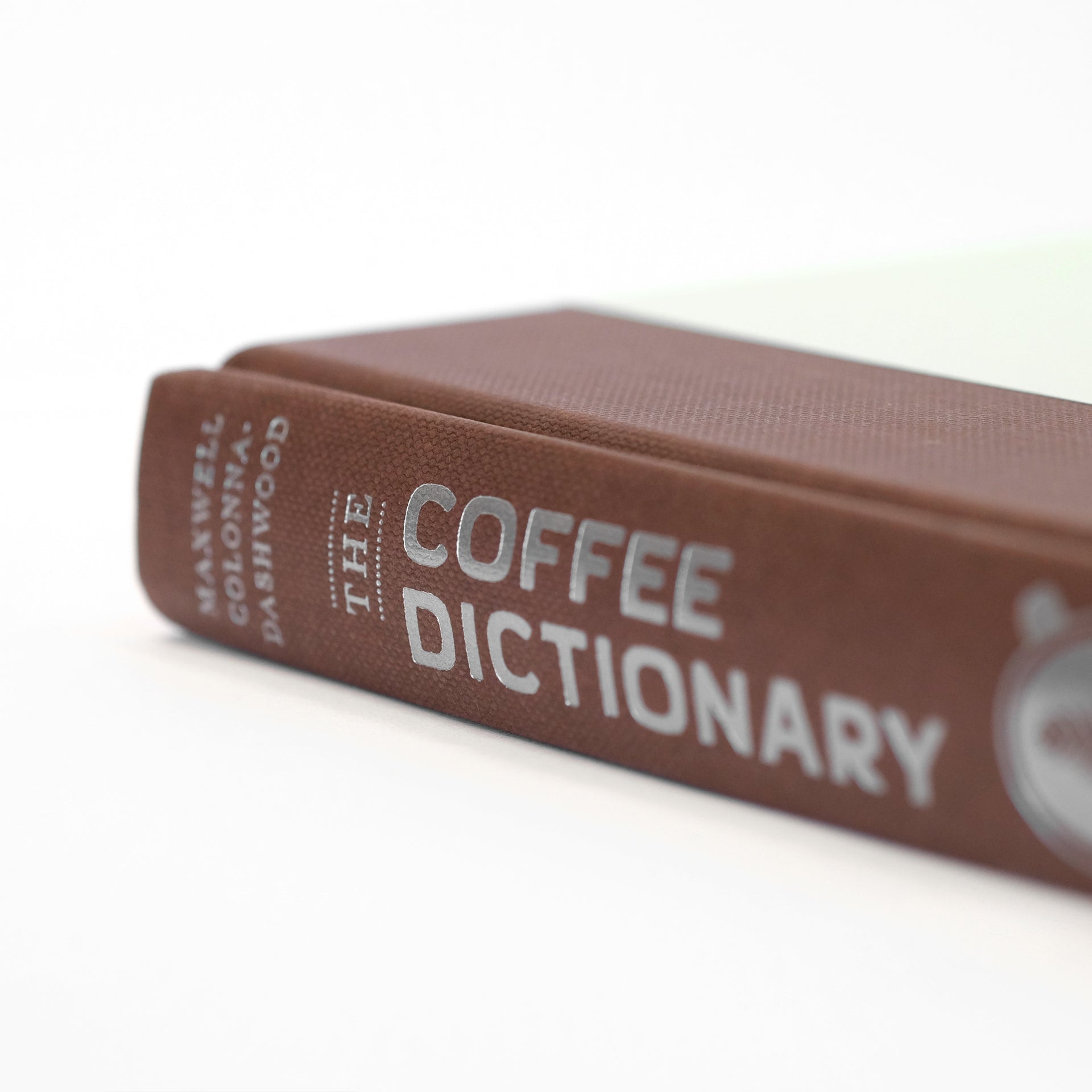 Close-up of pages from Cloud Picker Coffee's The Coffee Dictionary, showing detailed coffee terminology and illustrations.