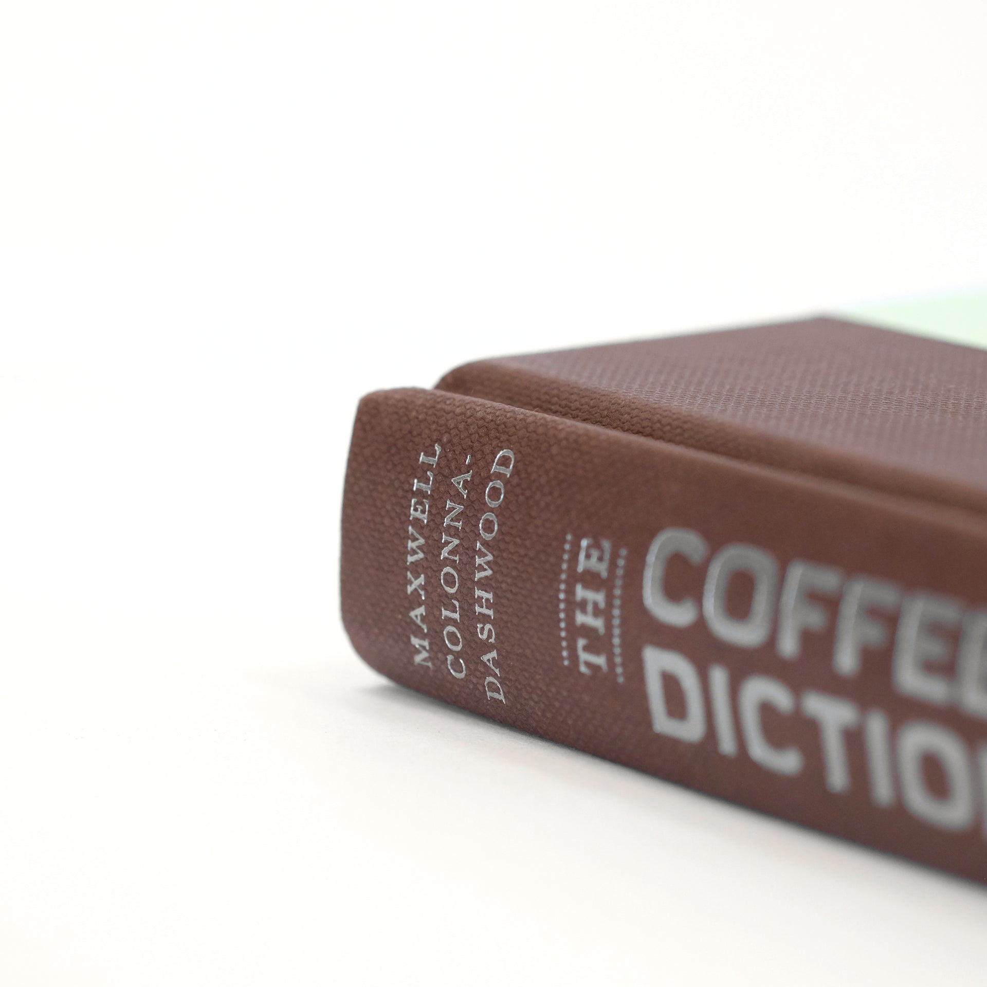 Close-up of a page from Cloud Picker Coffee's The Coffee Dictionary accessory, showcasing detailed coffee terminology and illustrations.