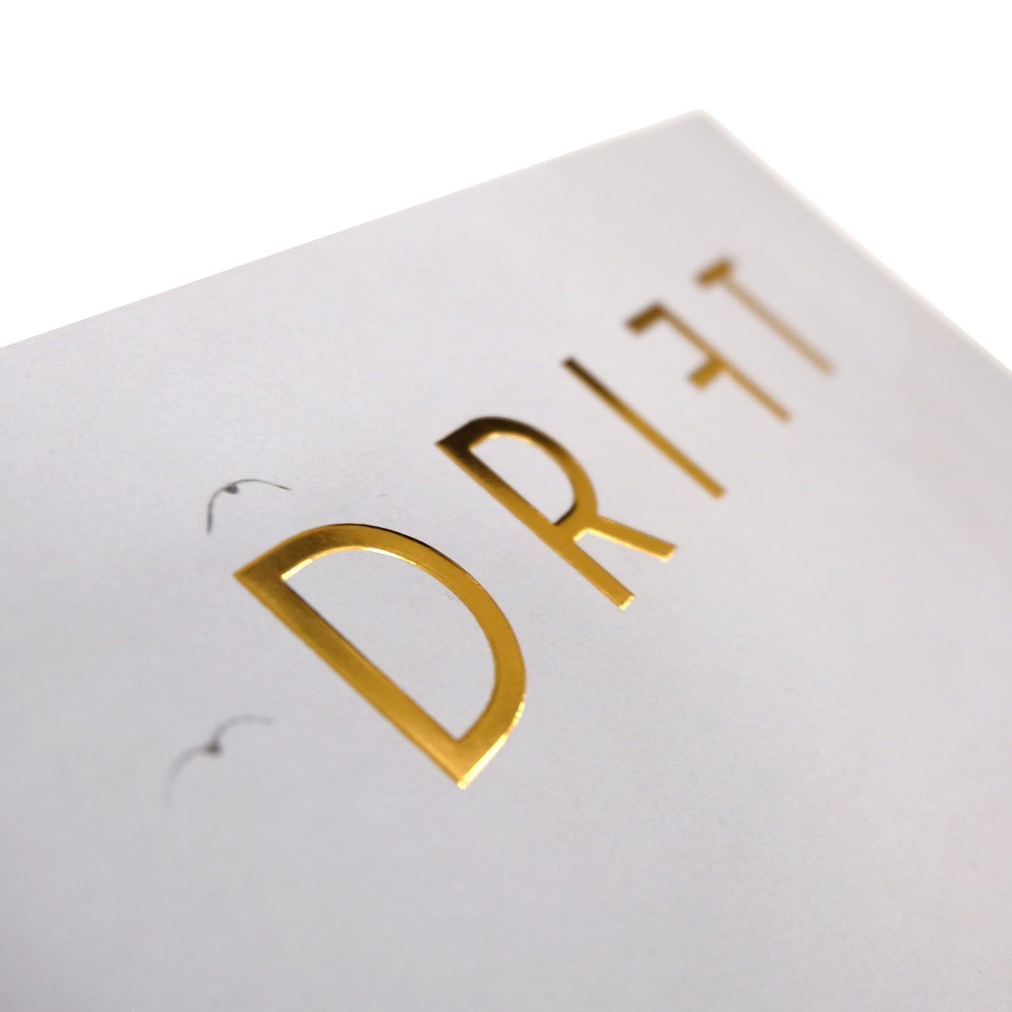 Close-up of Drift Magazine accessories by Cloud Picker Coffee featuring stylish design details and branding elements.