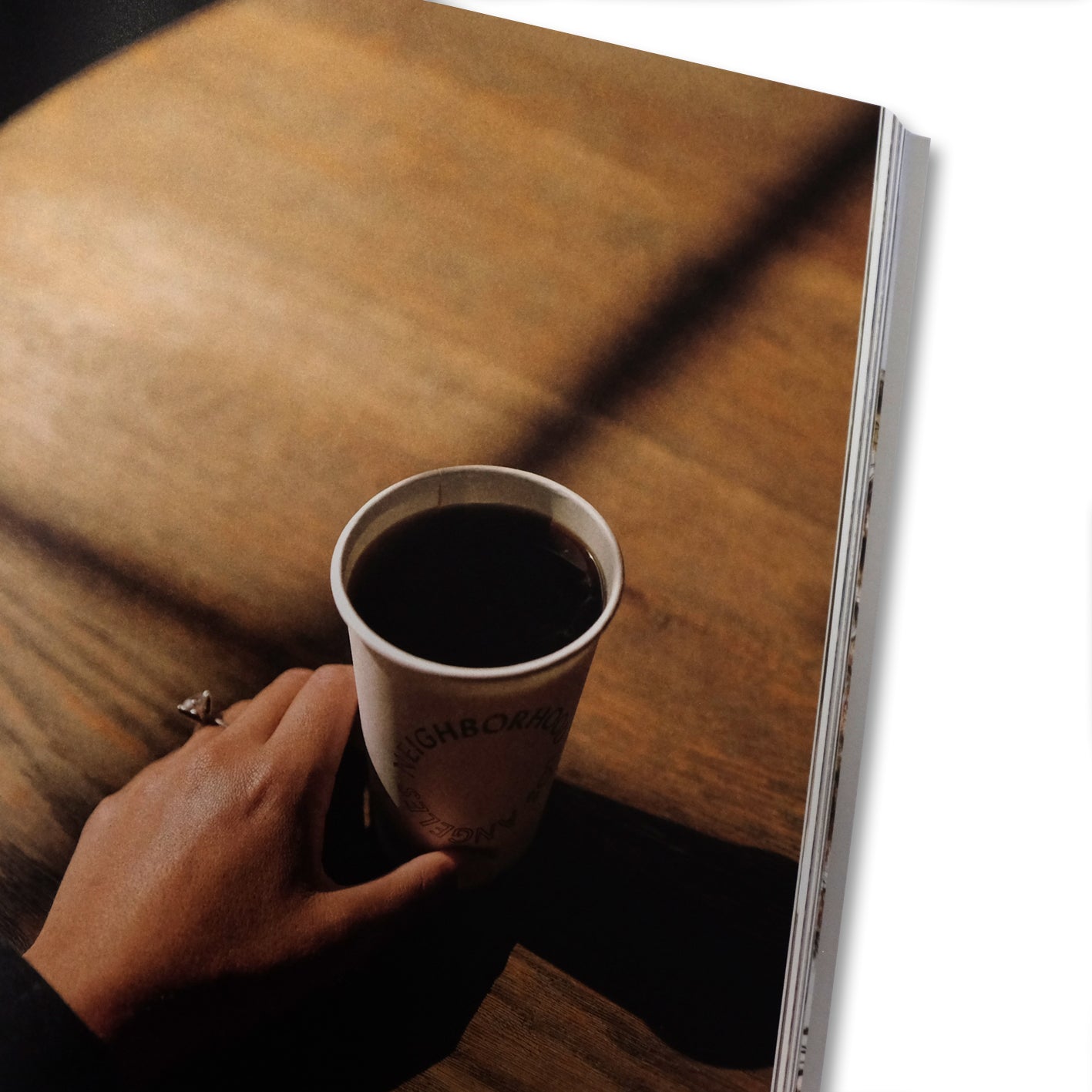 Close-up of Drift Magazine accessories featuring Los Angeles cityscape detail with Cloud Picker Coffee branding.
