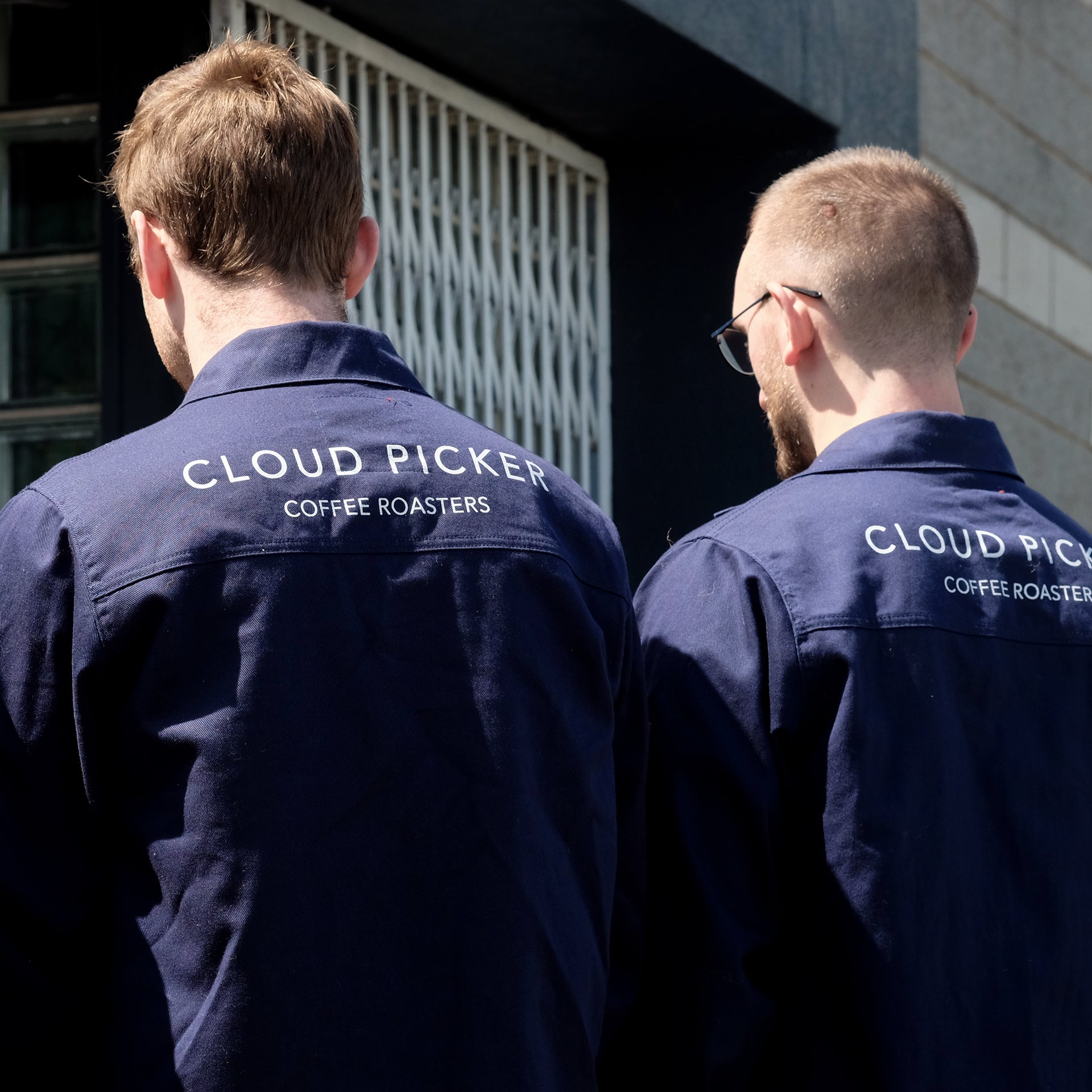 Unisex Cloud Picker Coffee roaster jacket, durable merchandise with adjustable straps and logo, designed for coffee roasting professionals.