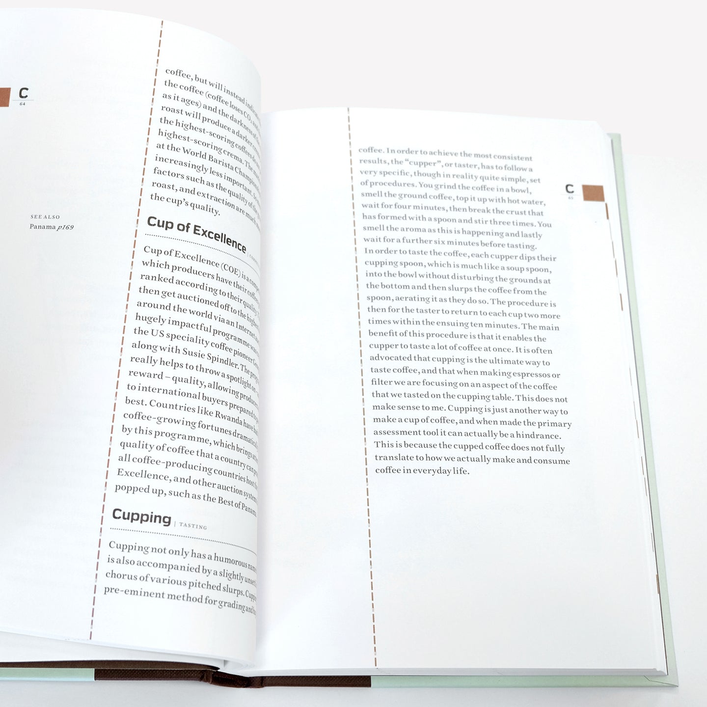Open spread of "The Coffee Dictionary" accessory book by Cloud Picker Coffee, featuring pages with coffee terminology and illustrations.