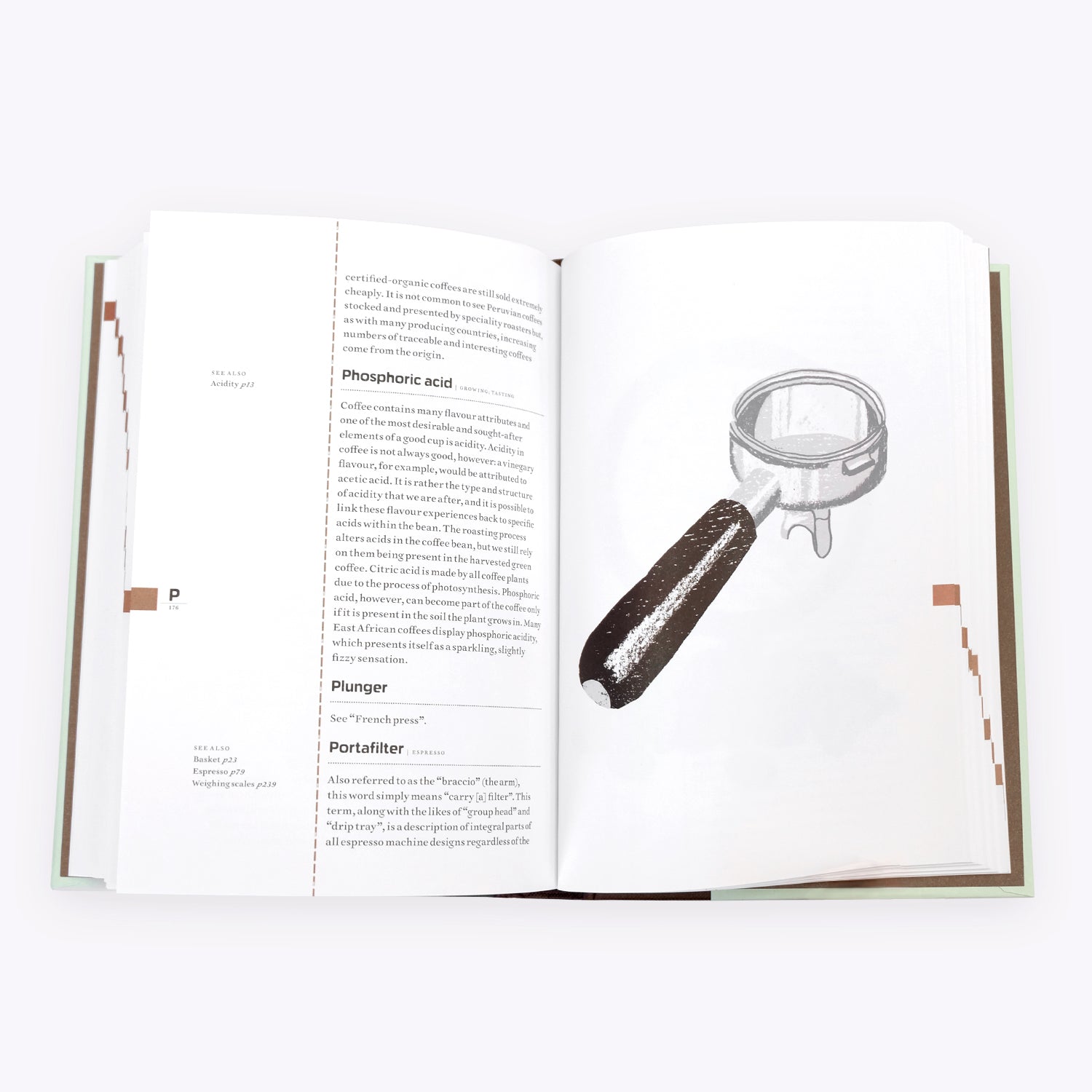 Open page of The Coffee Dictionary accessory by Cloud Picker Coffee showing coffee brewing terms and illustrations.