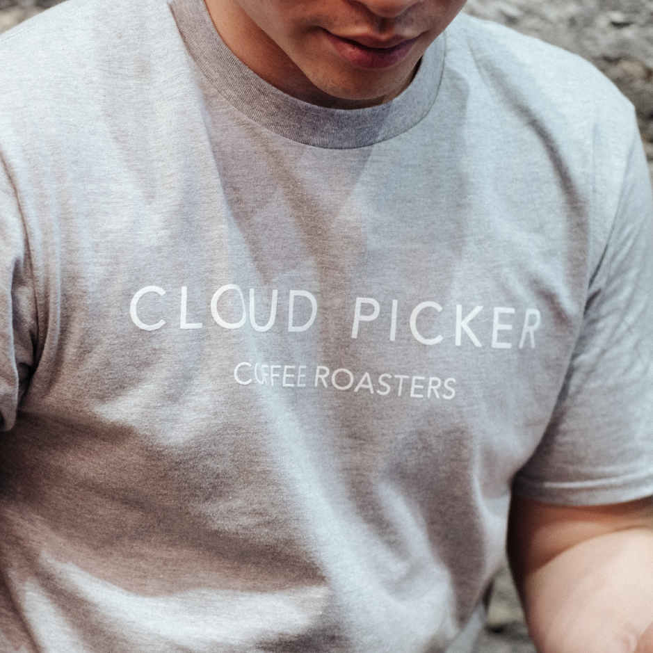 White print T-shirt from Cloud Picker Coffee merchandise featuring a casual design on the front.