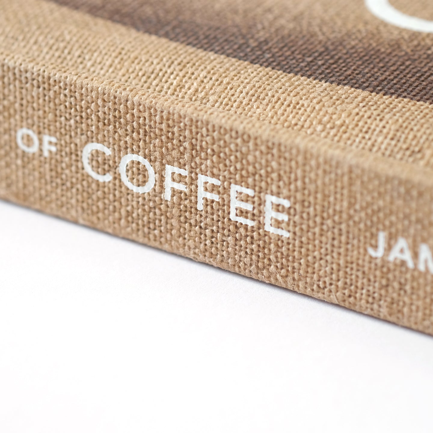 Detailed image of the merchandise "The World Atlas of Coffee" by Cloud Picker Coffee featuring the coffee-themed book cover.