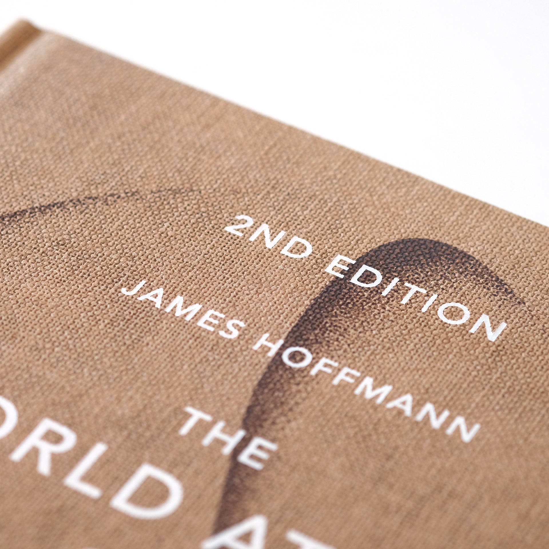 Detailed image of The World Atlas of Coffee merchandise by Cloud Picker Coffee, showcasing the book's vibrant cover design.